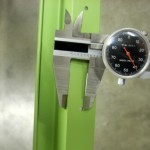 Calipers measuring a part